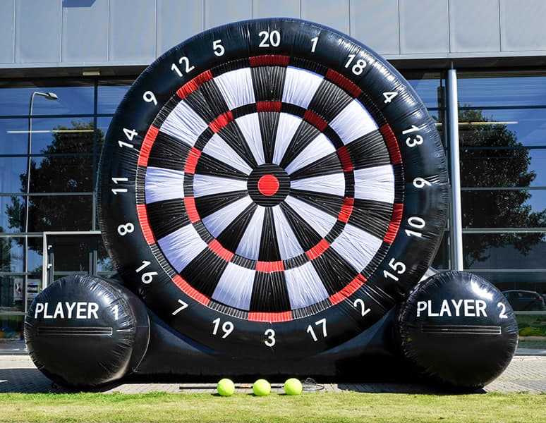 Inflatable football dartboard with Velcro footballs stuck to the target