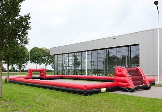 Inflatable football pitch with inflatable side walls set up for a match
